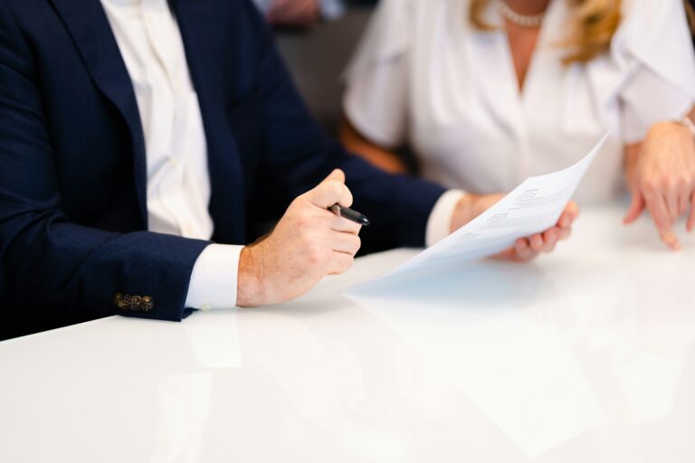 A couple reviewing documents together while preparing for divorce mediation